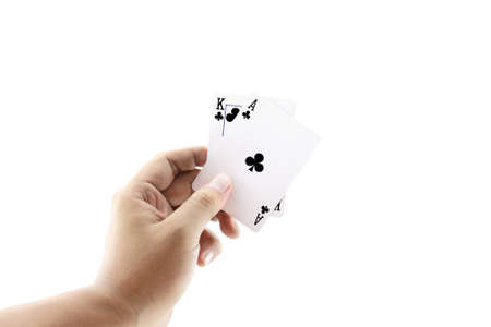 Black Jack two card of clubs in playing cards game in the hand on a white background ,focused on...