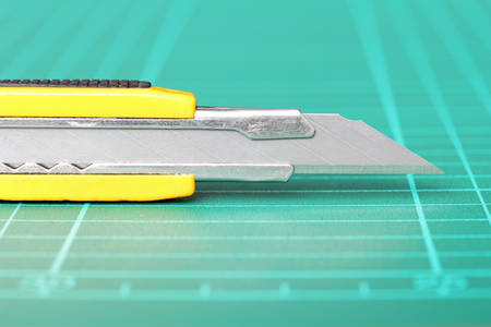 A closeup photo of cutter with scratches from use , Focused on a sharp blade