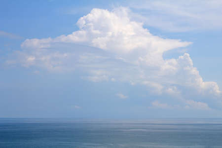 Background of sky and clouds in the vast empty ocean in Thailand.