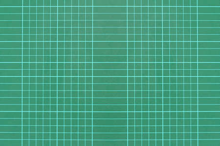 Green grid pattern background of cutting mat , Through the useの写真素材