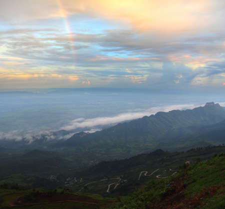 natural rainbow over mountain peak