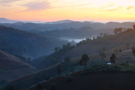 Beautiful scenery during sunrise with the mist at Ban Huay Kon ,Chaloem Phra Kiat district ,Nan province in Thailand is a very popular for photographer and tourists. Attractions and natural Conceptの写真素材