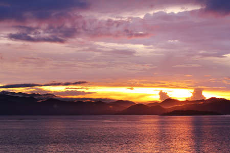 Natural background of colorful sky and mountain during sunset at Kaeng Krachan Dam, Kaengkrachan National Park ,Petcahburi  in Thailand. Attractions and natural Concept.の写真素材