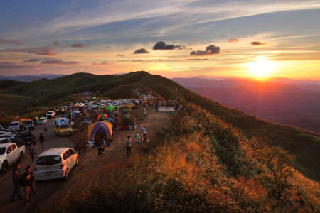 Thailand - December 30,2017 : Many cars of tourists come camping and let's see beautiful of natural and during sunset in long weekend at Nern Chang Suek Mountain, Kanchanaburi province in Thailand.のeditorial素材
