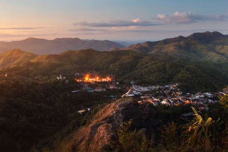 Beautiful scenery during sunset at Nern Chang Suek Mountain and the village in the middle of the...