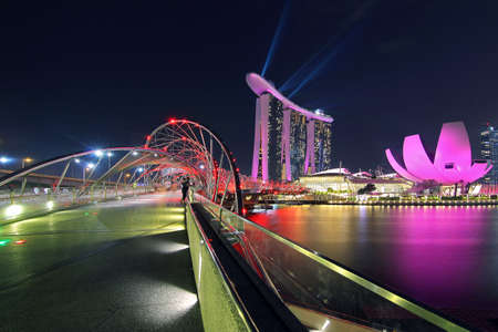 Singapore - July 31, 2017: Helix bridge and Marina Bay Sand during twilight time is famous landmark and very popular for photographers and tourists of Singapore cityのeditorial素材