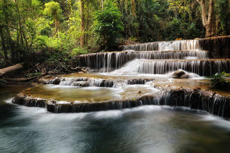 A beautiful view of Huay Mae khamin waterfall at Kanchanaburi province in Thailand. traveling and...
