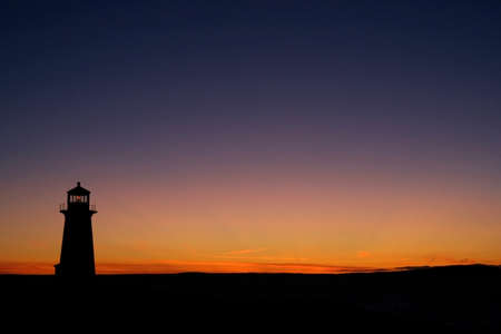 Lighthouse during sunset at Peggys Coveの写真素材