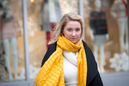 Winter portrait of young Caucasian woman in apparel district, photographed in NYC in Decemberの写真素材
