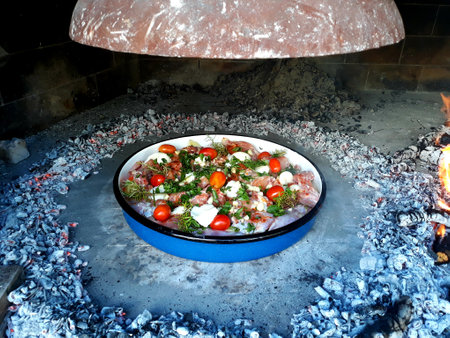 Traditional Croatia food preparing "peka"の写真素材
