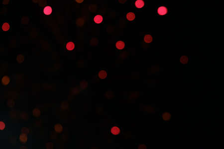abstract background bokeh  red fireworks in the night skyの写真素材