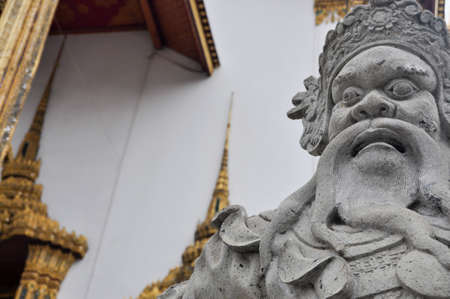 Thai attractions - Old vintage Chinese warrior statue in public Buddhism temple at  Wat Phra Kaew (the temple in grand palace) in Bangkok Thailandの写真素材