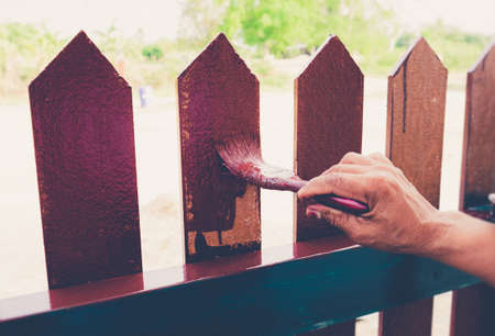 Painting the fence houseの写真素材