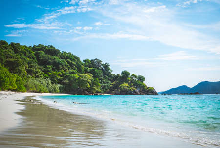 The beach and mountains scenery with blue skyの写真素材