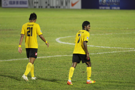 JOHOR BAHRU - JANUARY 14 ; Negeri Sembilan players ready for second half after half time team talk during a Malaysian Super League match between Johor FC and Negeri Sembilan at JCorp Stadium in Pasir Gudang on January 14th 2012  のeditorial素材