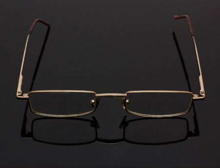 Metal-rimmed glasses.