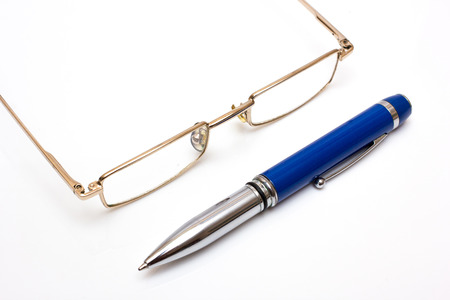 Glasses and pen on whiteの写真素材