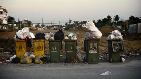 Rubbish bin at roadside and it is fully with garbageの写真素材