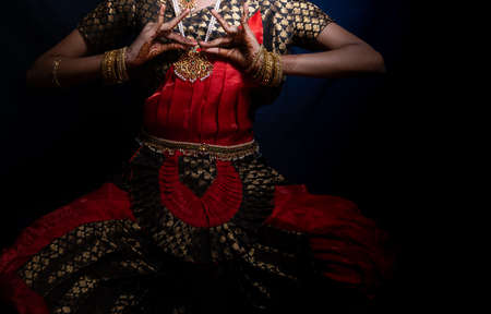 An indian dance form Bharatnatyam pose given by a girlの写真素材