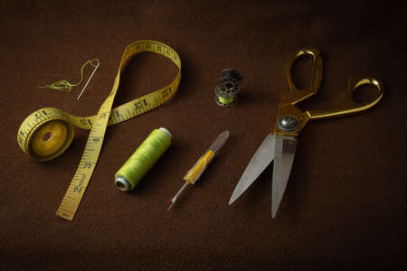 Tailoring materials kept on a brown matte backgroundの写真素材