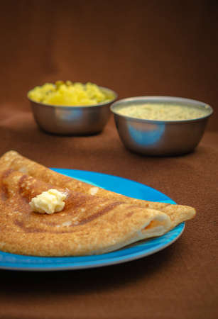 Indian special dosa with butter for a healthy home made breakfastの写真素材