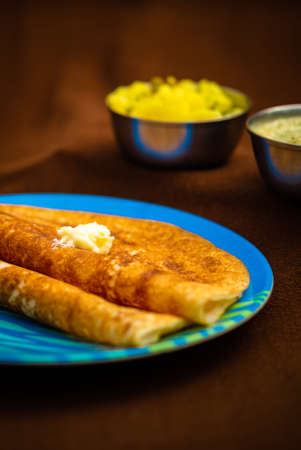 Indian special dosa with butter for a healthy home made breakfastの写真素材