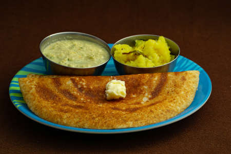 Indian special dosa with butter for a healthy home made breakfastの写真素材