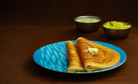 Indian special dosa with butter for a healthy home made breakfastの写真素材