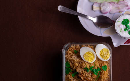 Delicious looking home made chicken biriyani in a bowl ready to be served