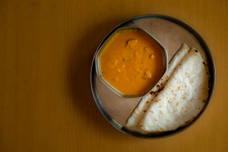 Healthy and homemade roti and curry for morning breakfastの写真素材