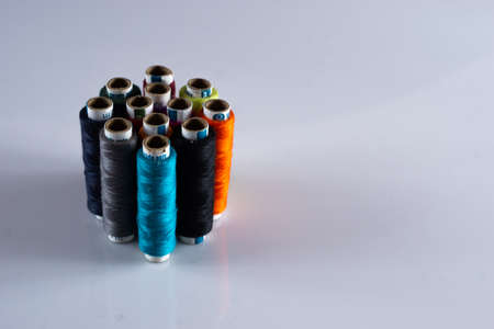 Tailoring stitching thread rolls on a white backgroundの写真素材