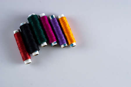 Tailoring stitching thread rolls on a white backgroundの写真素材