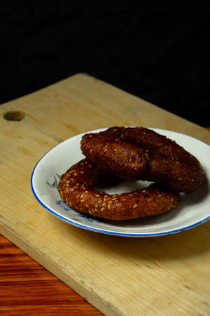 Tasty homemade kajjaya in a white plate kept on a light background