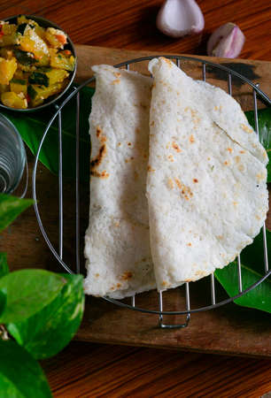 South Indian special tasty and delicious homemade roti with sabji on the tableの写真素材