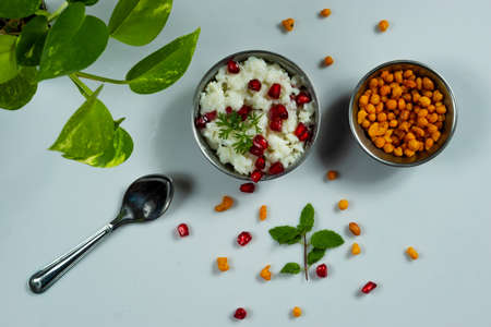 Homemade delicious and tasty curd rice with mixture on a white backgroundの写真素材