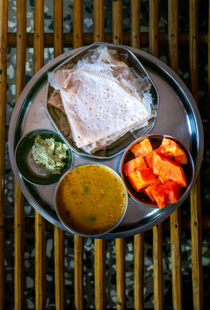 Homemade dosa with chutney and sambar for breakfastの写真素材