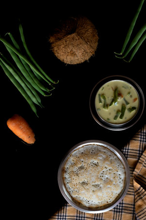 Homemade tasty Set dosa along with vegetable stew on a dark backgroundの写真素材
