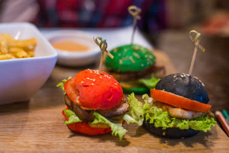 three small burgers for children in the restaurant.
