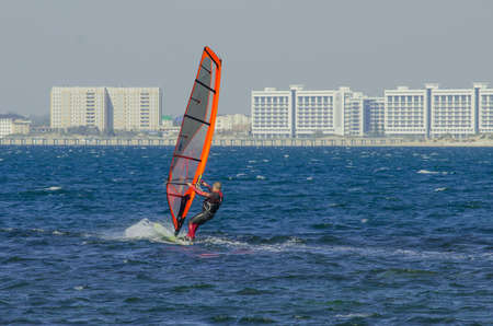 Anapa, Russia-June 15, 2020: Recreational Water Sports. Windsurfing. Windsurfer Surfing The Wind On...