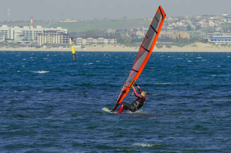 Anapa, Russia-June 15, 2020: Recreational Water Sports. Windsurfing. Windsurfer Surfing The Wind On...