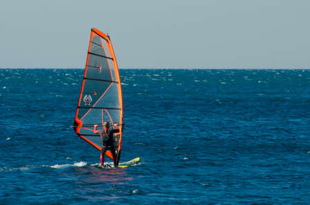 Anapa, Russia-June 15, 2020: Recreational Water Sports. Windsurfing. Windsurfer Surfing The Wind On...