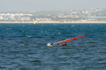 Anapa, Russia-June 15, 2020: Recreational Water Sports. Windsurfing. Windsurfer Surfing The Wind On...