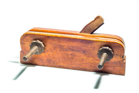 Old vintage wooden jointer Veritas Small Plow Plane isolated on a white background.