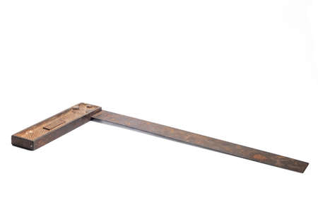 vintage machinist layout square tool over white. an old metal corner ruler isolated