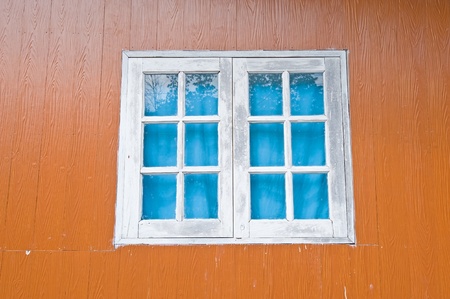 Vintage window on wooden house