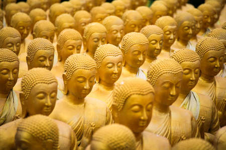 Golden Buddha statues perspectiveの写真素材