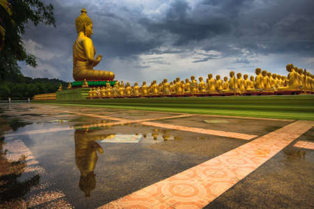 Golden Buddha statues reflectionの写真素材