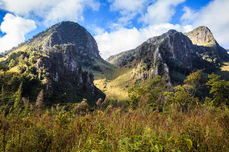 mountain peak and raining fog blue sky