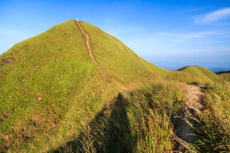 trails on the mountain peak  and blue skyの写真素材