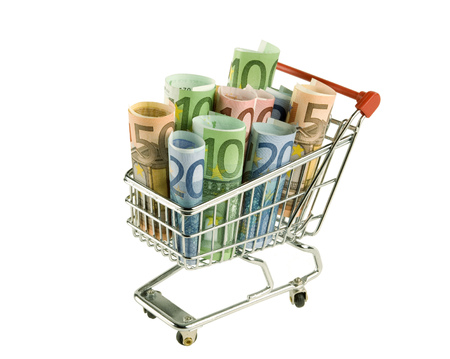 Isolated shopping cart with euro banknotesの写真素材